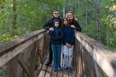 The Futrell family on a forest bridge