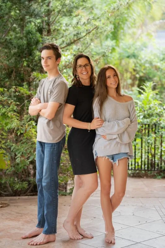 Jill Futrell with the kids on a garden portico