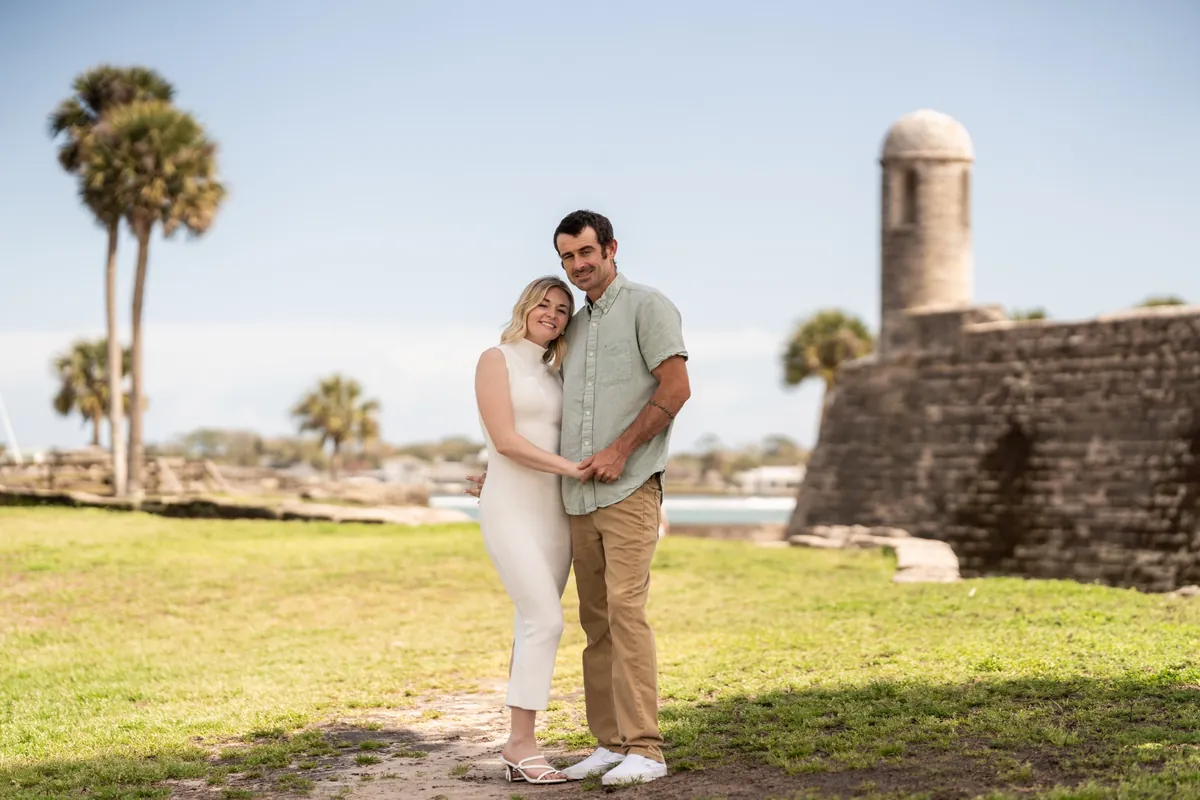 A couple embracing at the Castillo de San Marcos in downtown St. Augustine