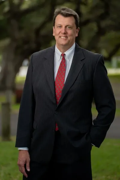 Executive portrait outdoors under oak trees, St. Augustine