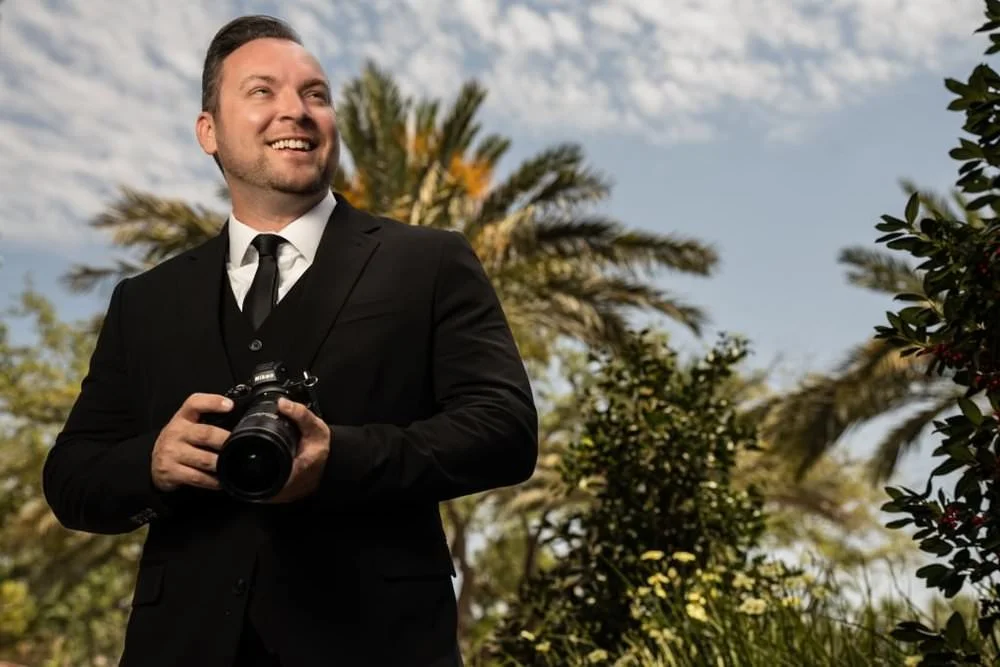 St Augustine photographer portrait with camera and palm trees