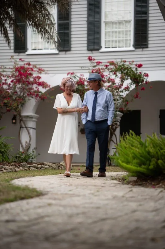Couple walking near historic building after St Augustine courthouse wedding