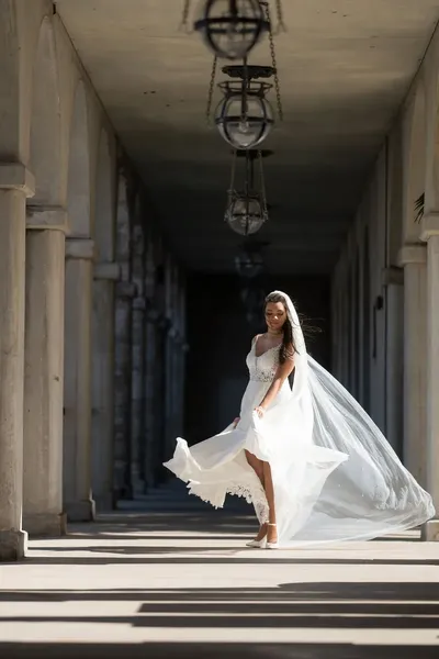 Bridal portrait in Flagler College colonnade with flowing veil
