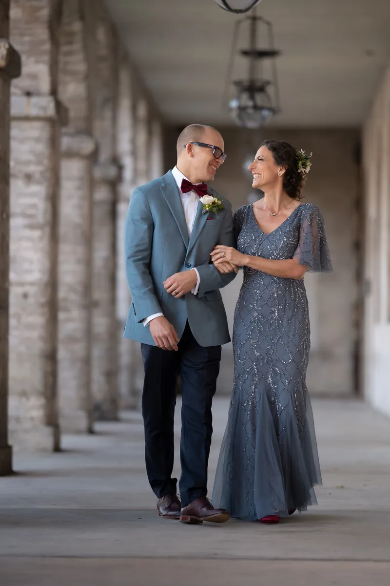 Couple walks through Flagler College colonnade during St Augustine elopement