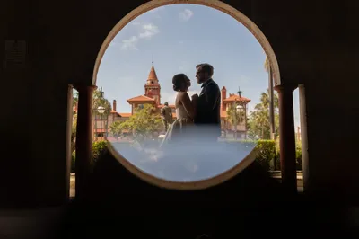 Bridal portrait beneath arches at Lightner Museum St Augustine