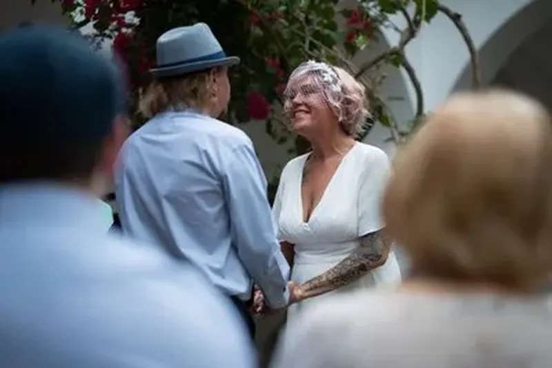 Intimate elopement ceremony at Pena-Peck House with bougainvillea