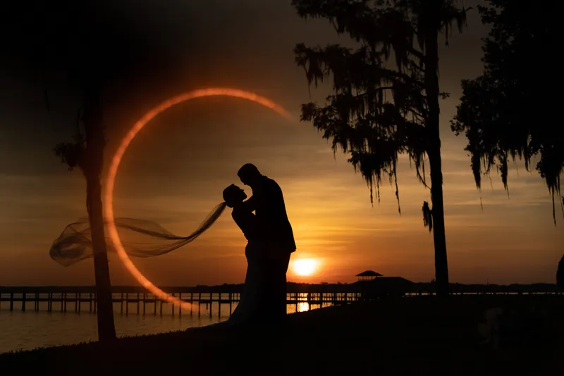 Dramatic silhouette with veil and light ring at St Johns River sunset