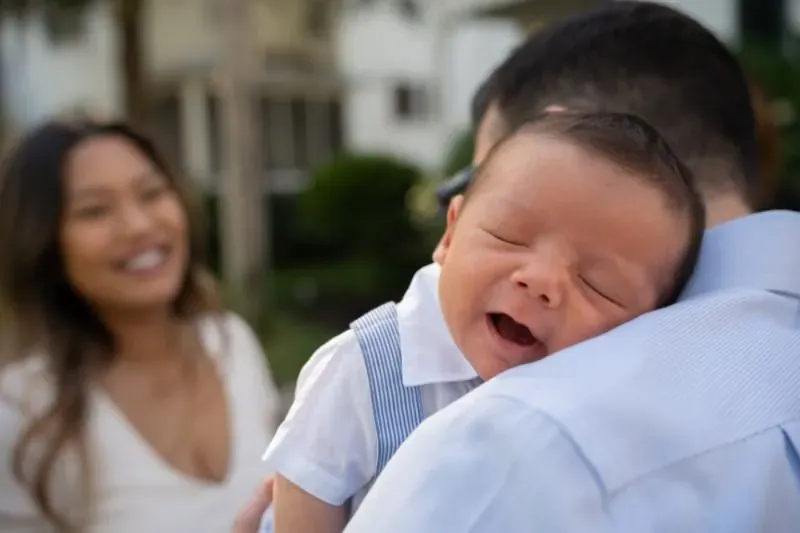 Baby in loving family embrace