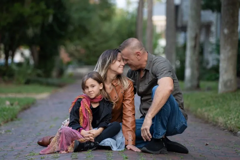 Candid family moment with daughter smirking