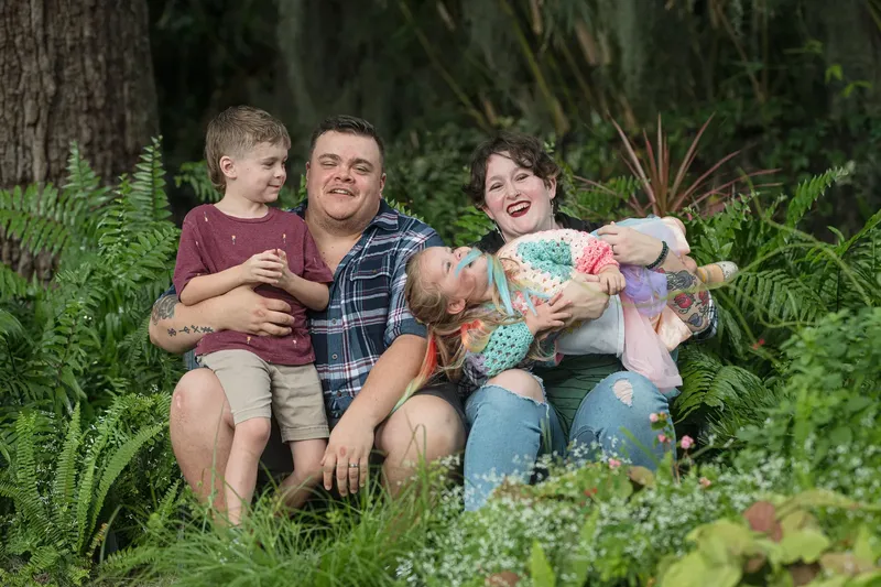 Family walking along the beach at sunset in Florida