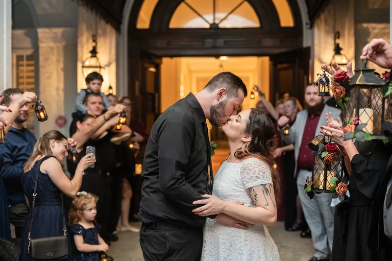 Jason and Alexandra share a quiet moment surrounded by guests during their reception.