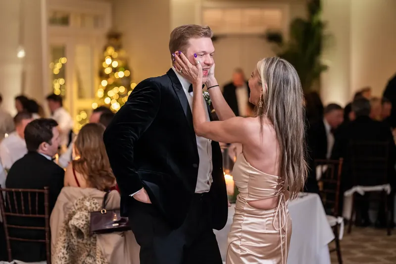 Craig touches Ashley's face as she smiles at the Sawgrass Marriott Golf Resort & Spa reception.