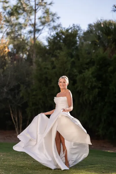 Ashley twirling her wedding dress on the golf course at Sawgrass Country Club