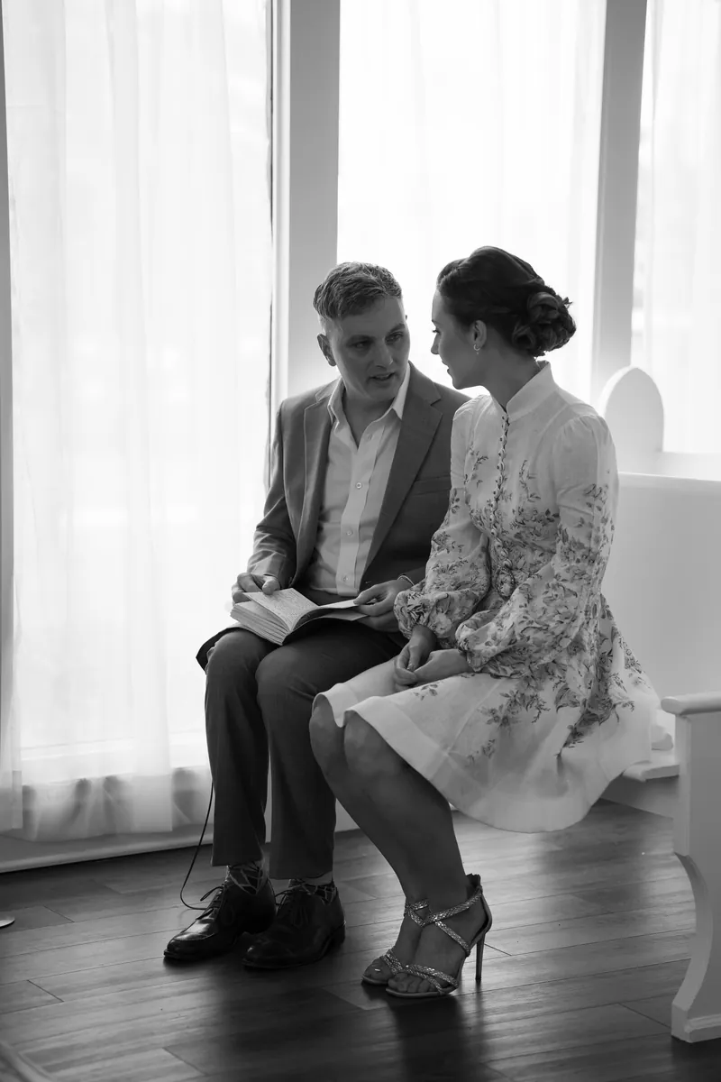 Black and white portrait of couple in chapel