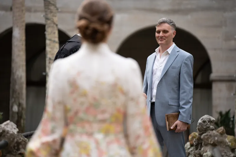 Bride walking down aisle of small chapel