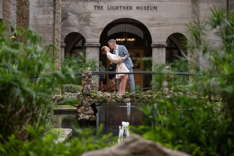Couple embracing in museum corridor