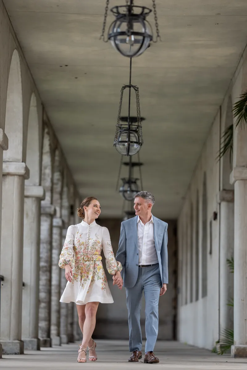 Bride portrait leaning against stone column