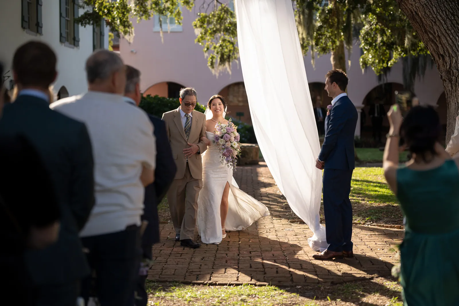 Bride walking down the aisle with father at the Oldest House ceremony