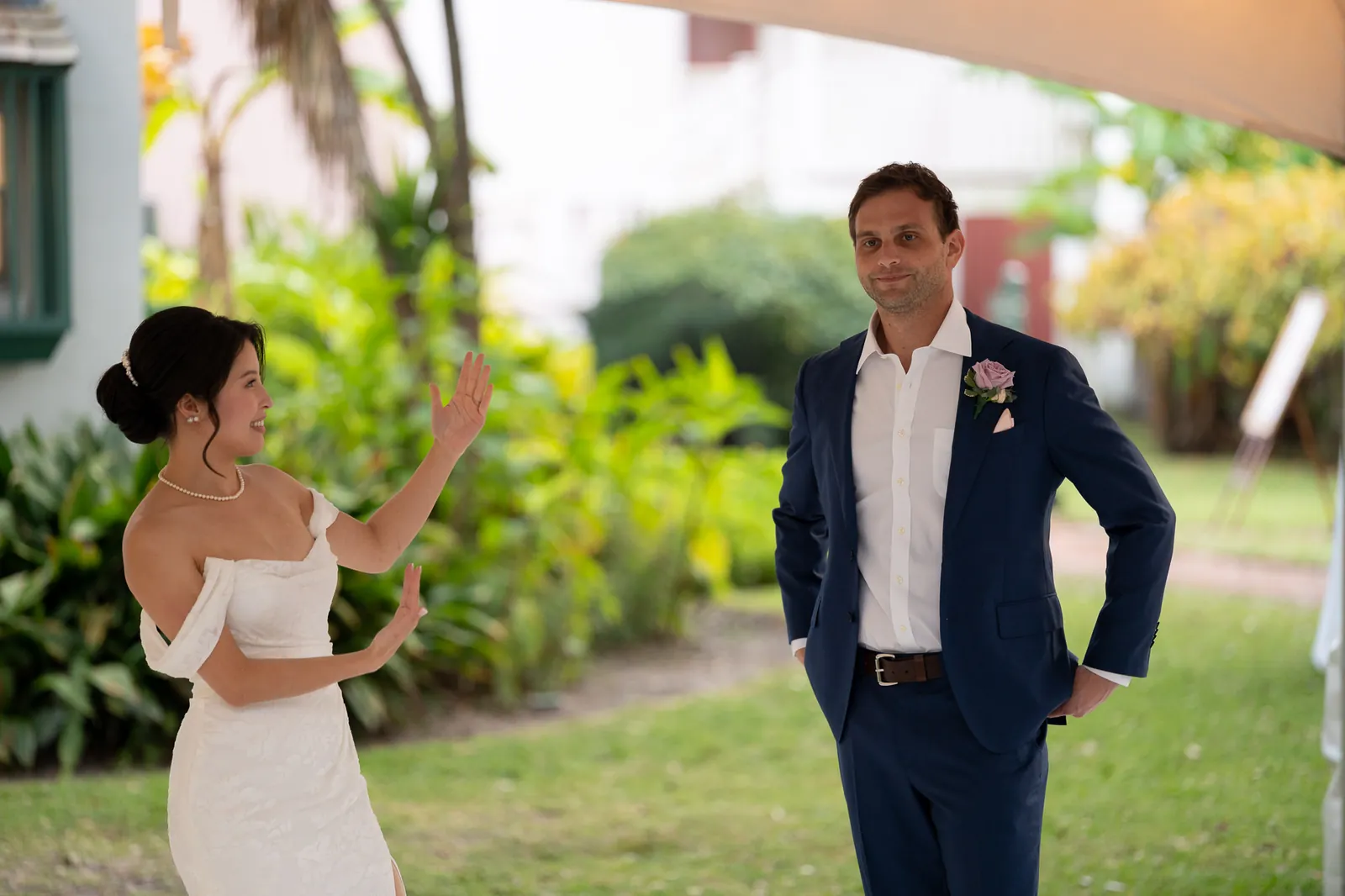 Candid moment between bride and groom at reception at the Oldest House