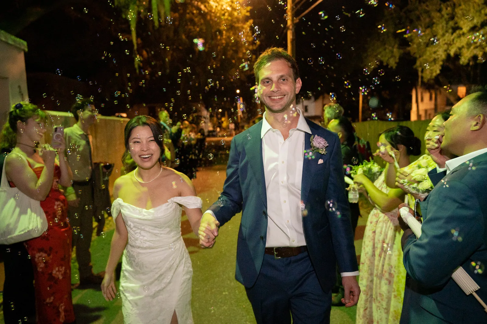 Bubble exit with couple laughing at the Oldest House wedding