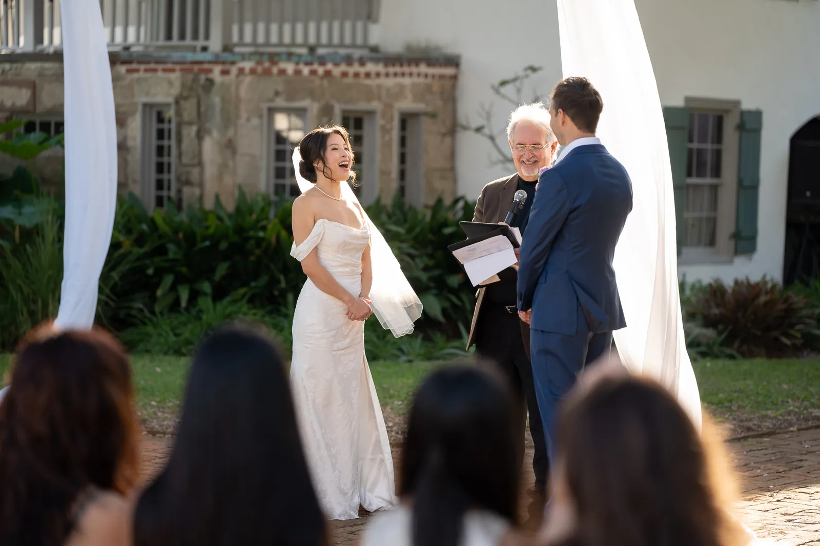 Binh laughing during wedding ceremony at the Oldest House St. Augustine