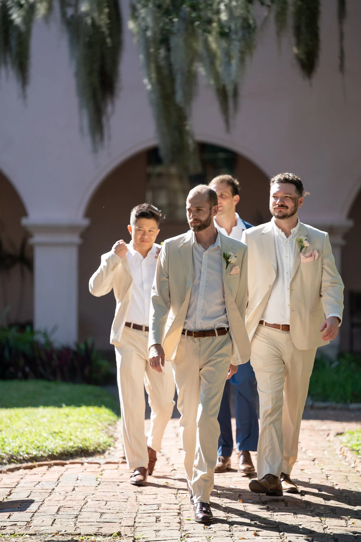 Groomsmen walking together at the Oldest House wedding