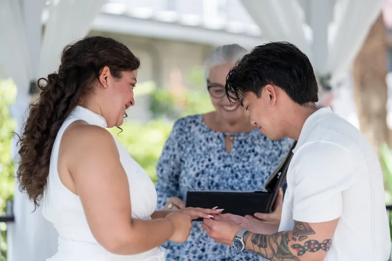 Blossom and Chris exchange vows with their officiant at Bayfront Marin House, St. Augustine.