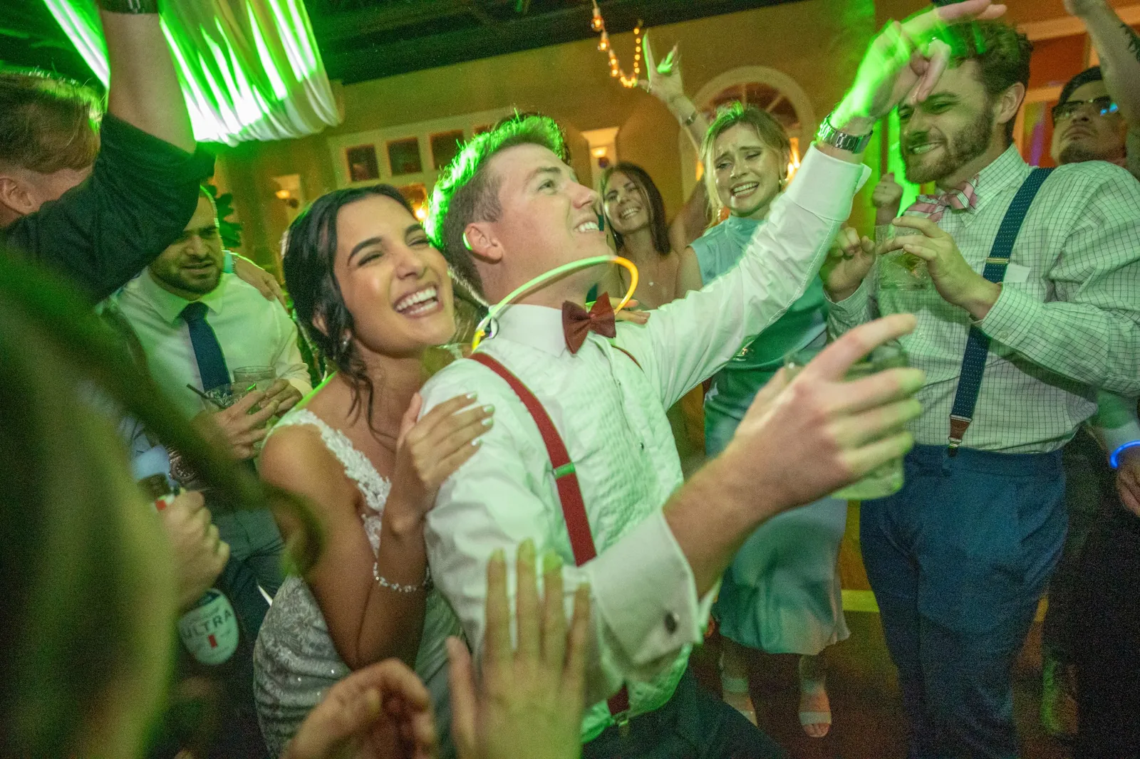 Bri and Nick dancing at party with groom in suspenders at The White Room