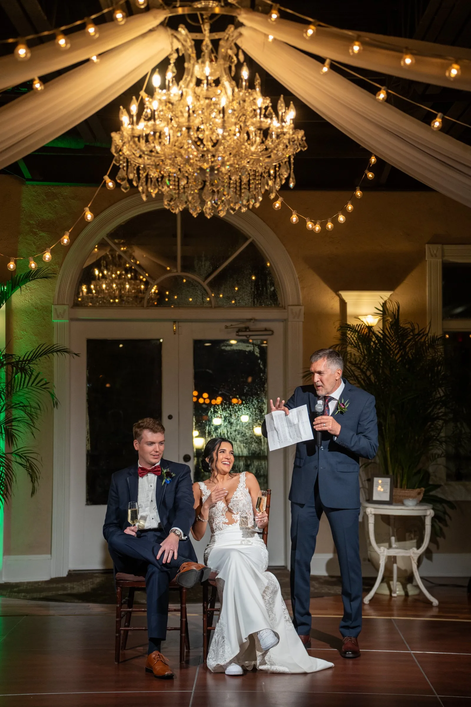Father of bride speech and toast under chandelier at The White Room