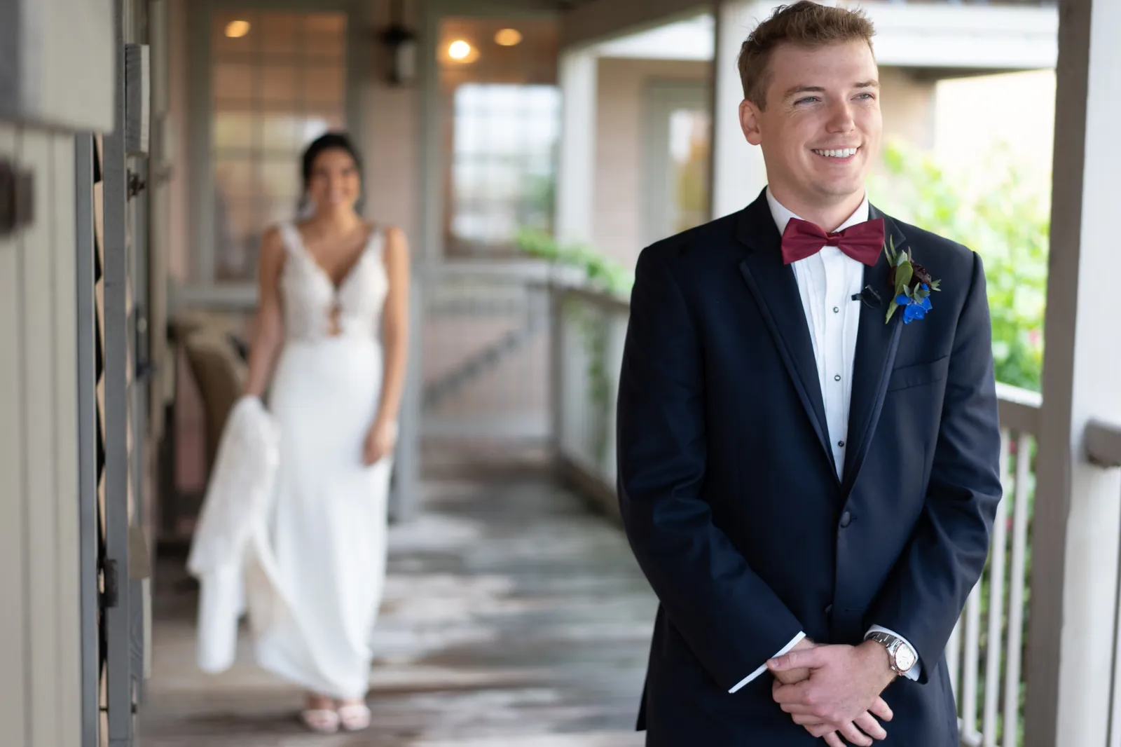 First look with groom Nick waiting as bride approaches at The White Room