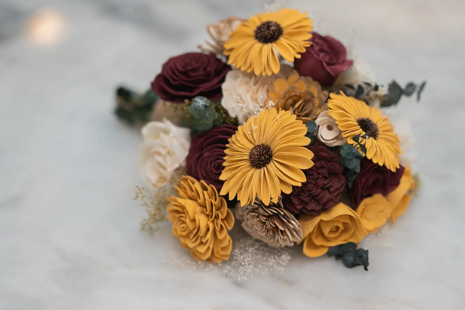 Fall wedding bouquet with sunflowers and burgundy roses