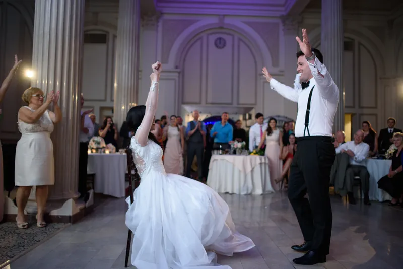 Michael and Choko share their first dance under grand columns at The Treasury on the Plaza.