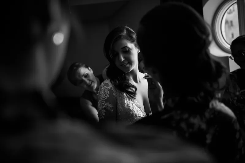 Choko sits surrounded by loved ones in an intimate moment during bridal preparations at Casa Monica Resort & Spa.