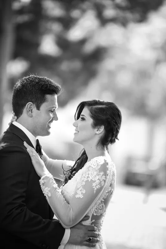 Michael and Choko face each other in close profile, foreheads nearly touching in a black and white portrait.