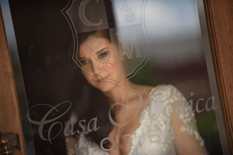Choko's face appears softly focused through sheer fabric, her expression serene and contemplative.