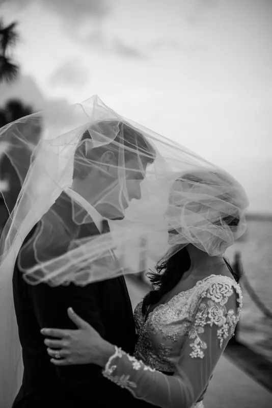 St. Augustine wedding photographer captures bride and groom under veil at Treasury Plaza