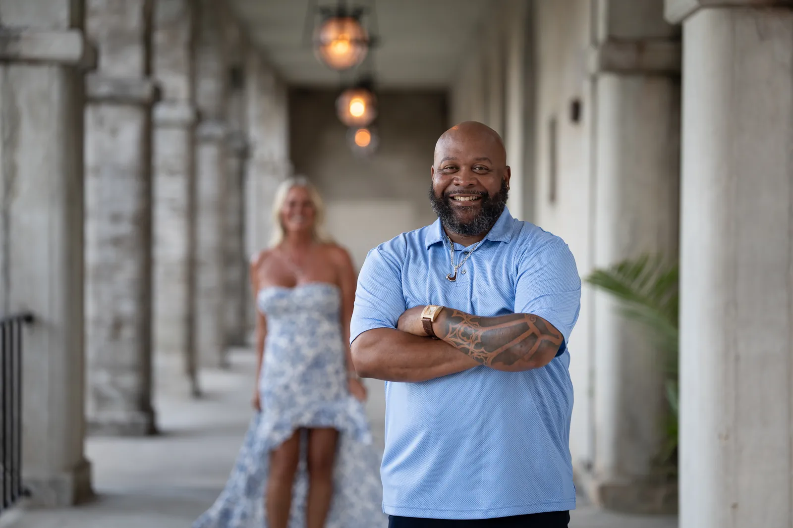 Dee smiling in Lightner colonnade with Tonya in background