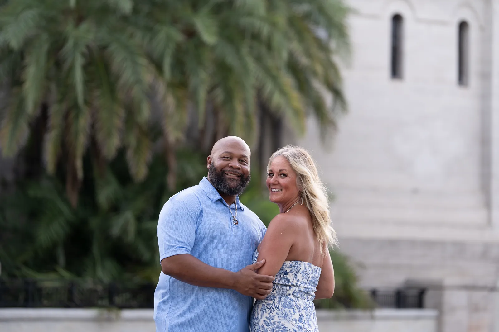 Couple portrait in front of Lightner Museum with palm trees