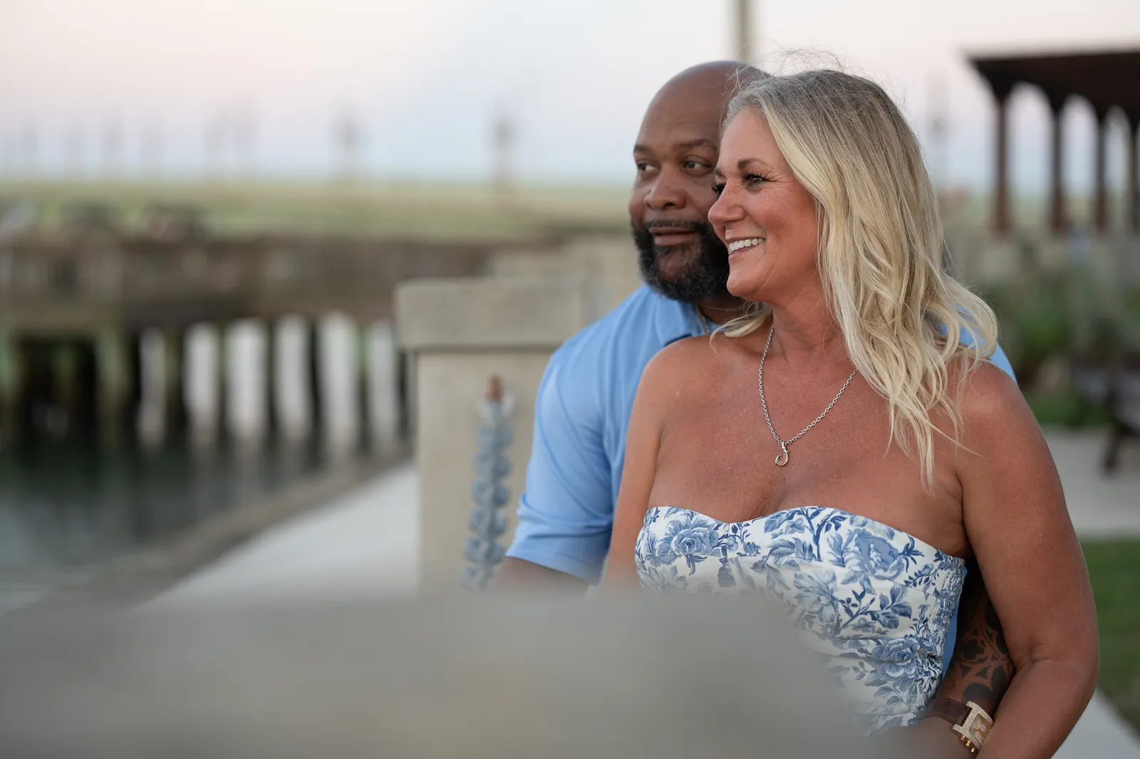 Dee and Tonya looking out over the water at sunset