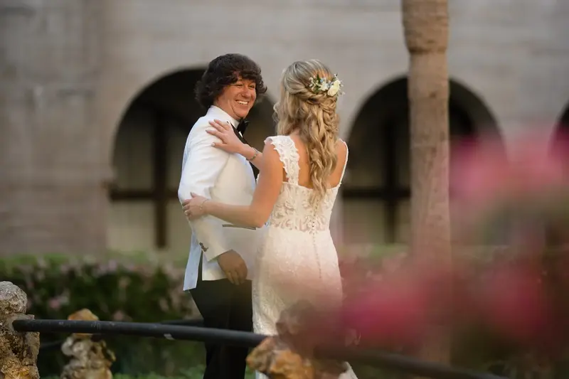 Groom seeing bride for the first time during first look in Lightner courtyard