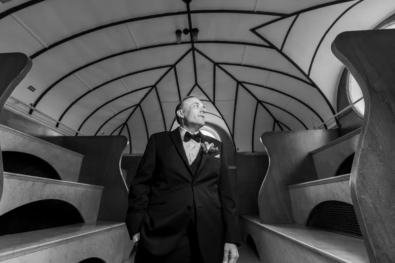 Black and white groom portrait looking up in the Lightner Museum Russian Baths