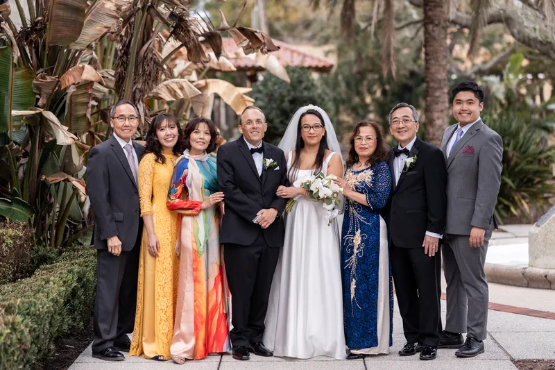 Family portrait with parents in traditional Vietnamese ao dai and formal attire