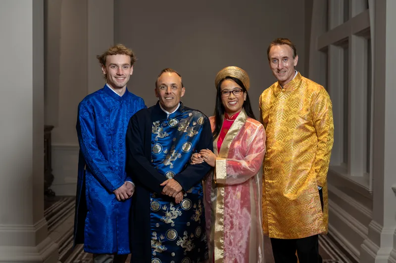 Groom's family and friends wearing Vietnamese ao dai at the Lightner Museum reception
