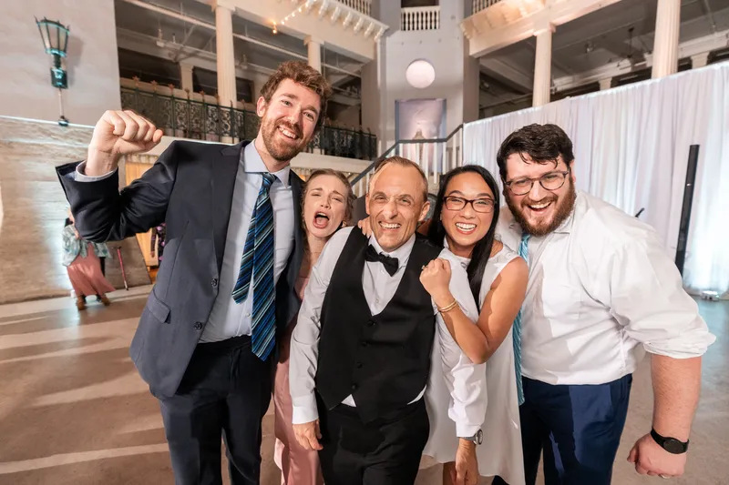 Couple celebrating with friends on the Lightner Museum dance floor