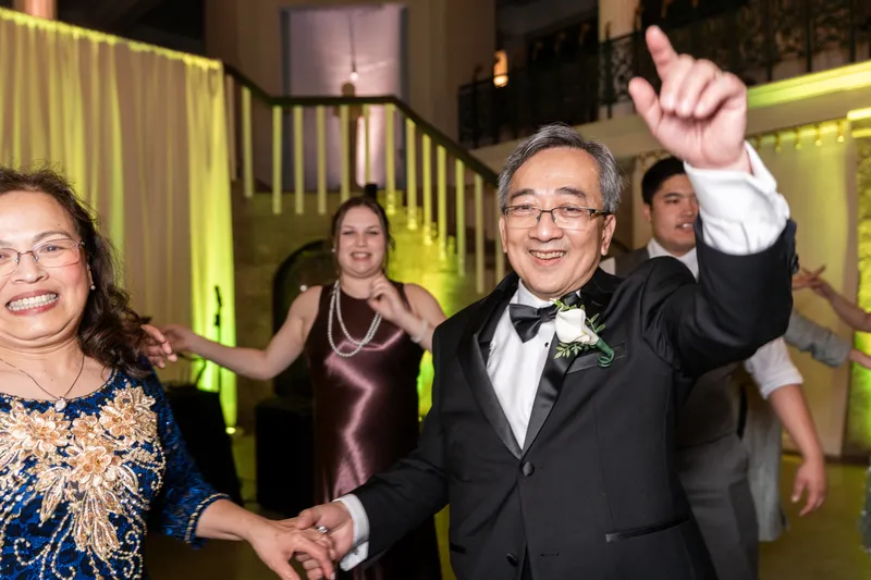 Bride's parents dancing together on the reception dance floor