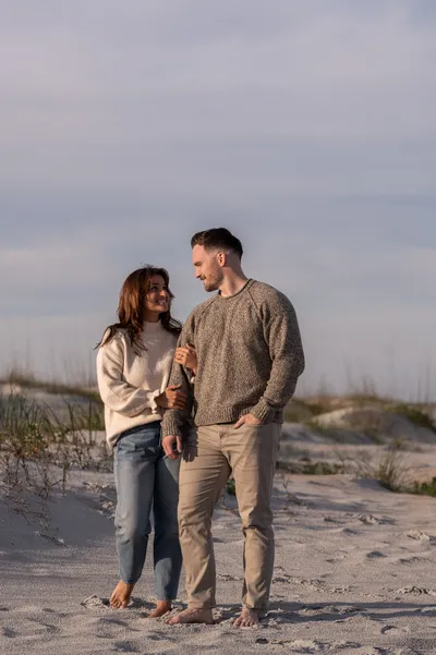 Romantic beach engagement portrait at Anastasia State Park during golden hour