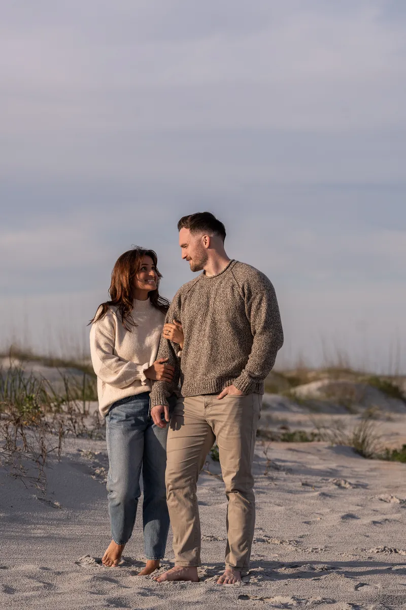 Romantic beach engagement portrait at Anastasia State Park during golden hour