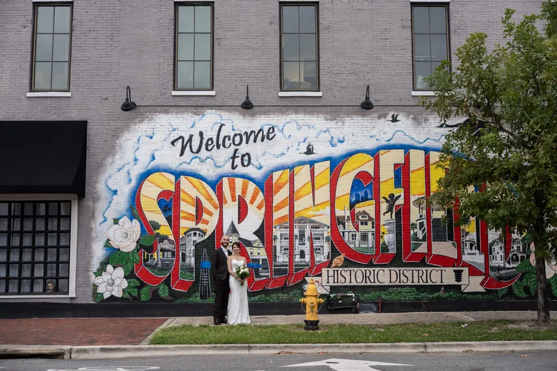 A "Welcome to Springfield" mural adorns the brick exterior wall of Brick and Beam's historic district location.