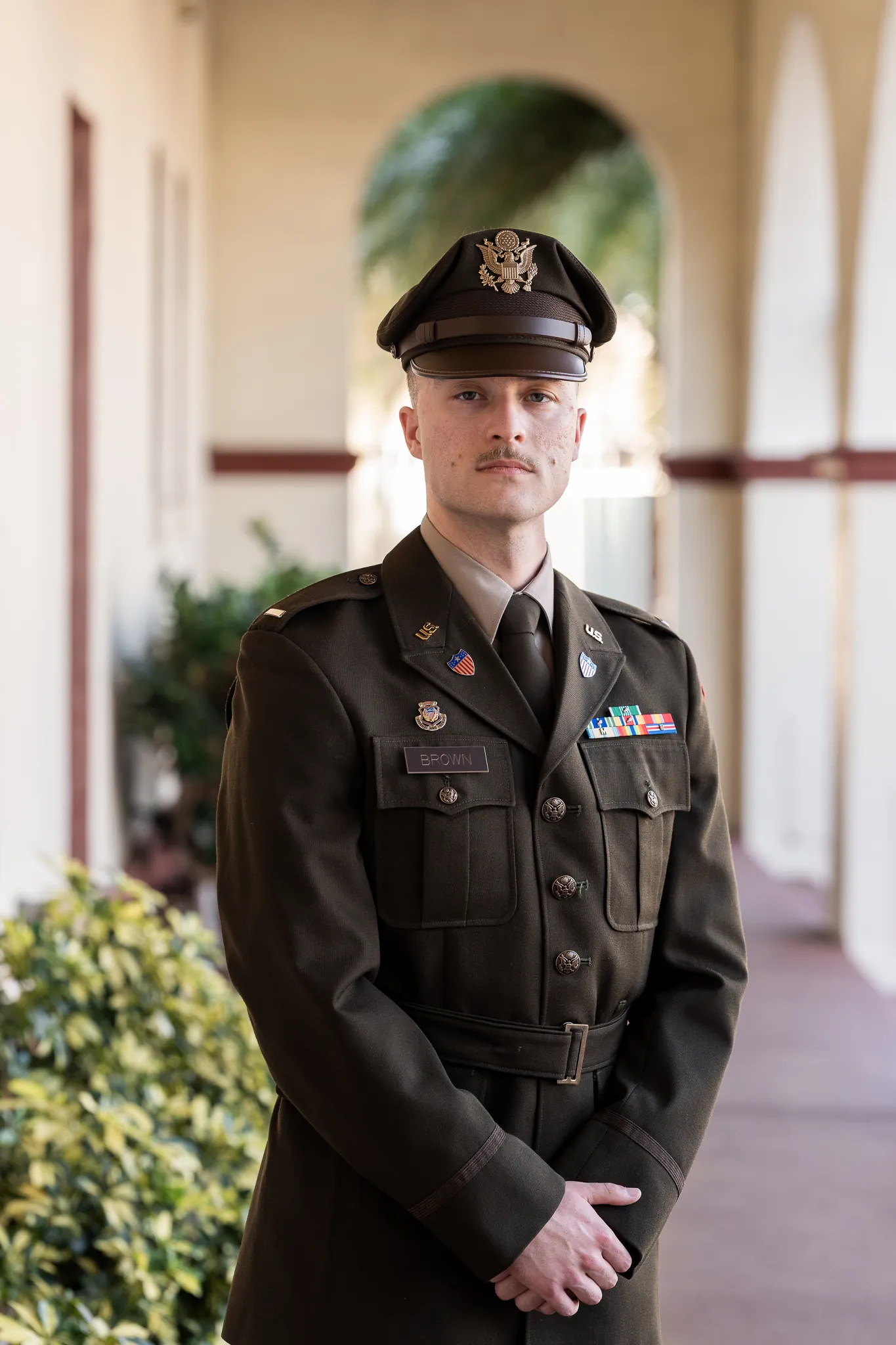Couple portrait in St. Augustine alleyway with purple bougainvillea