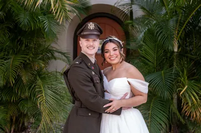 Bride with bridesmaids in sage green dresses at The Treasury